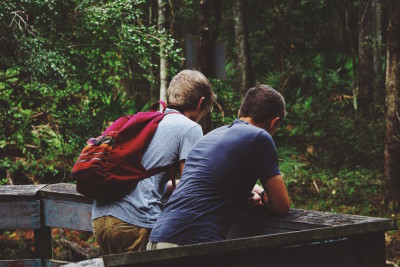 sharing the gospel rightly two friends guys talking image