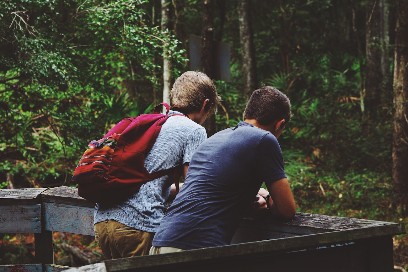 sharing the gospel rightly two friends guys talking image